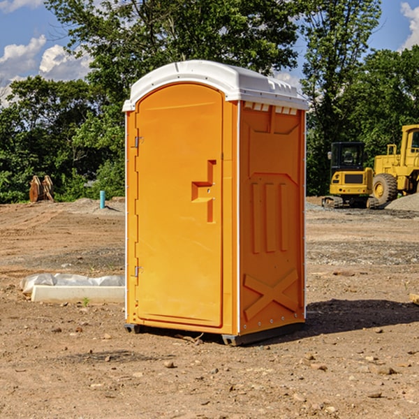 what is the cost difference between standard and deluxe portable restroom rentals in Katie